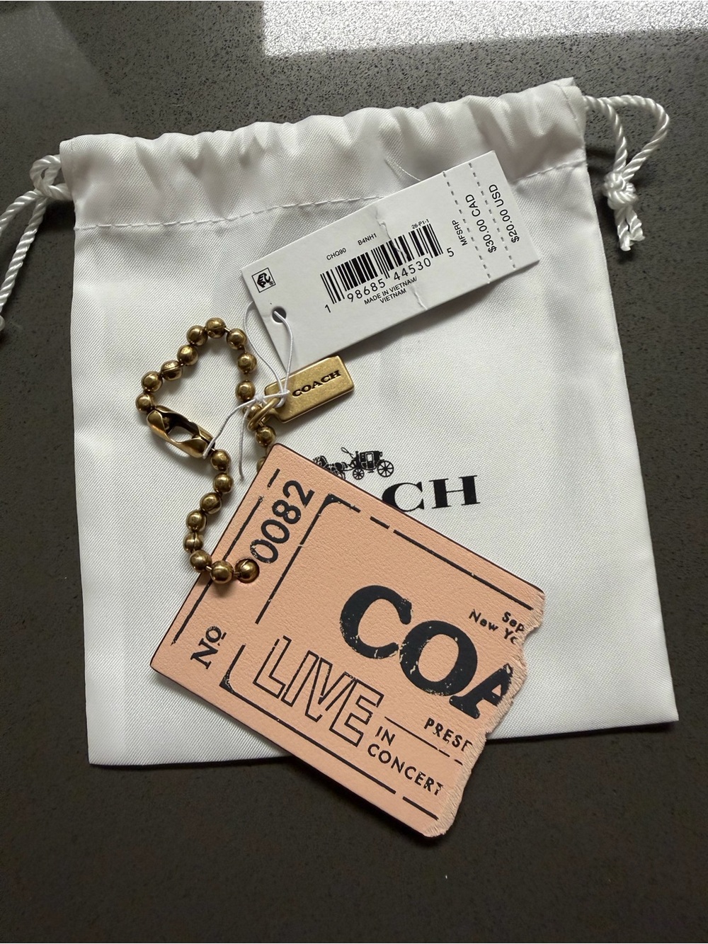 COACH Live in Concert - Ticket Bag Charm in Light Pink w/ Brass Hardware